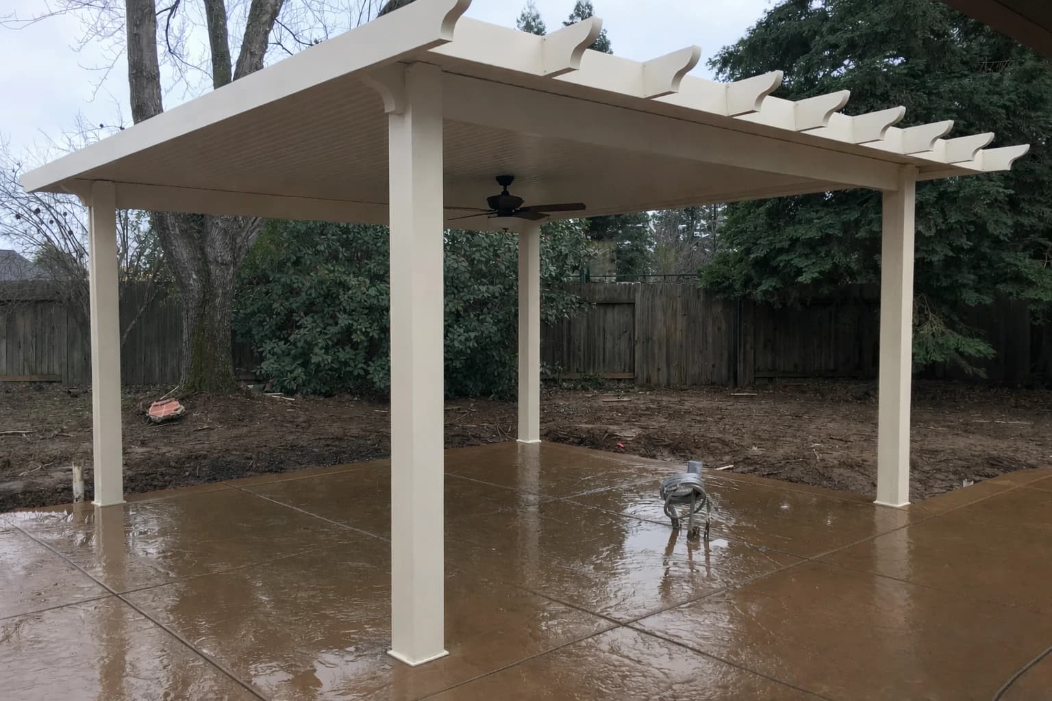 Freestanding solid patio cover near Folsom Lake with detached seating zone