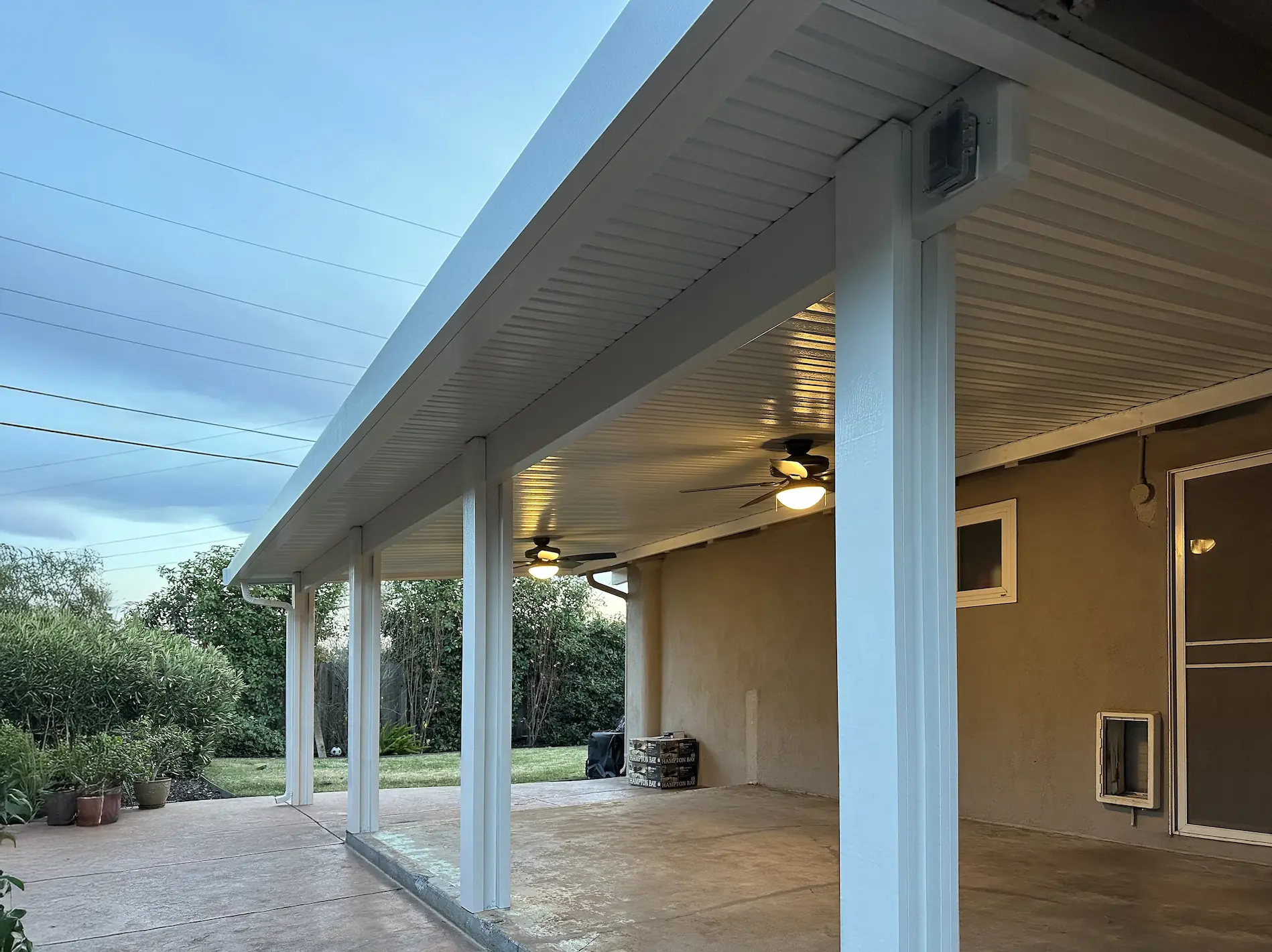 Solid patio cover with ceiling fan installed in Folsom by DCI Patios