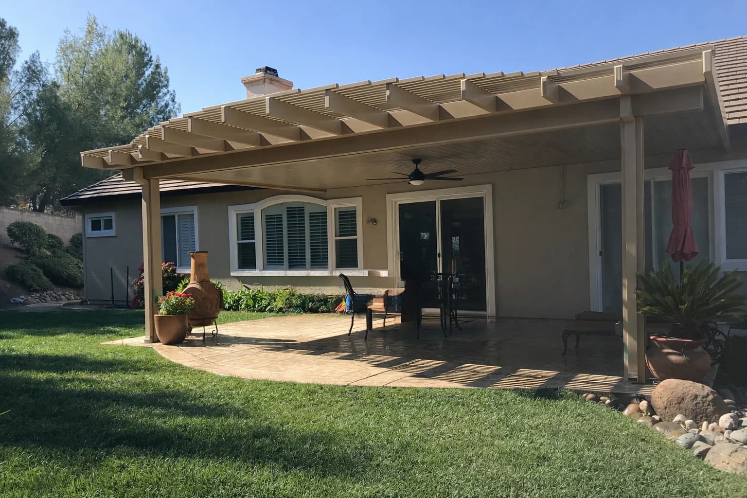 Custom combination patio cover with solid and lattice sections installed in El Dorado Hills by DCI Patios